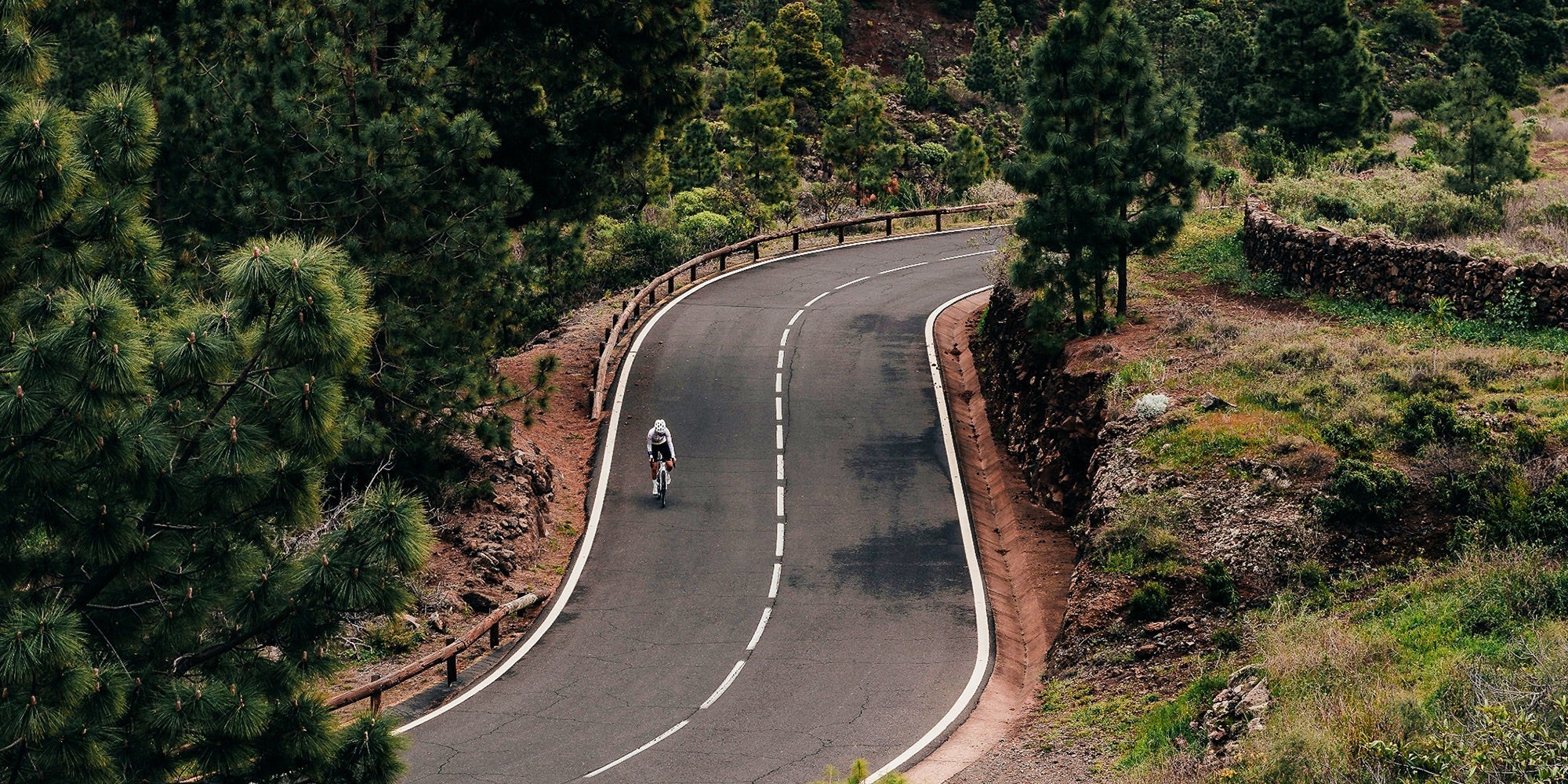 cyclist on winding mountain road