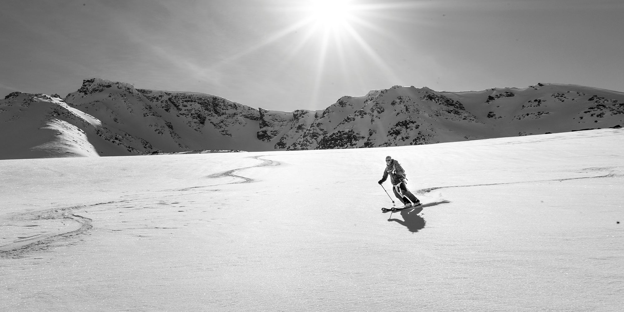 man skiing down mountain