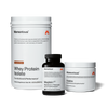 Tim's Performance Stack which includes a container of Chocolate flavor whey protein isolate, a bottle of Magnesium L-Threonate, and a jar of Creatine